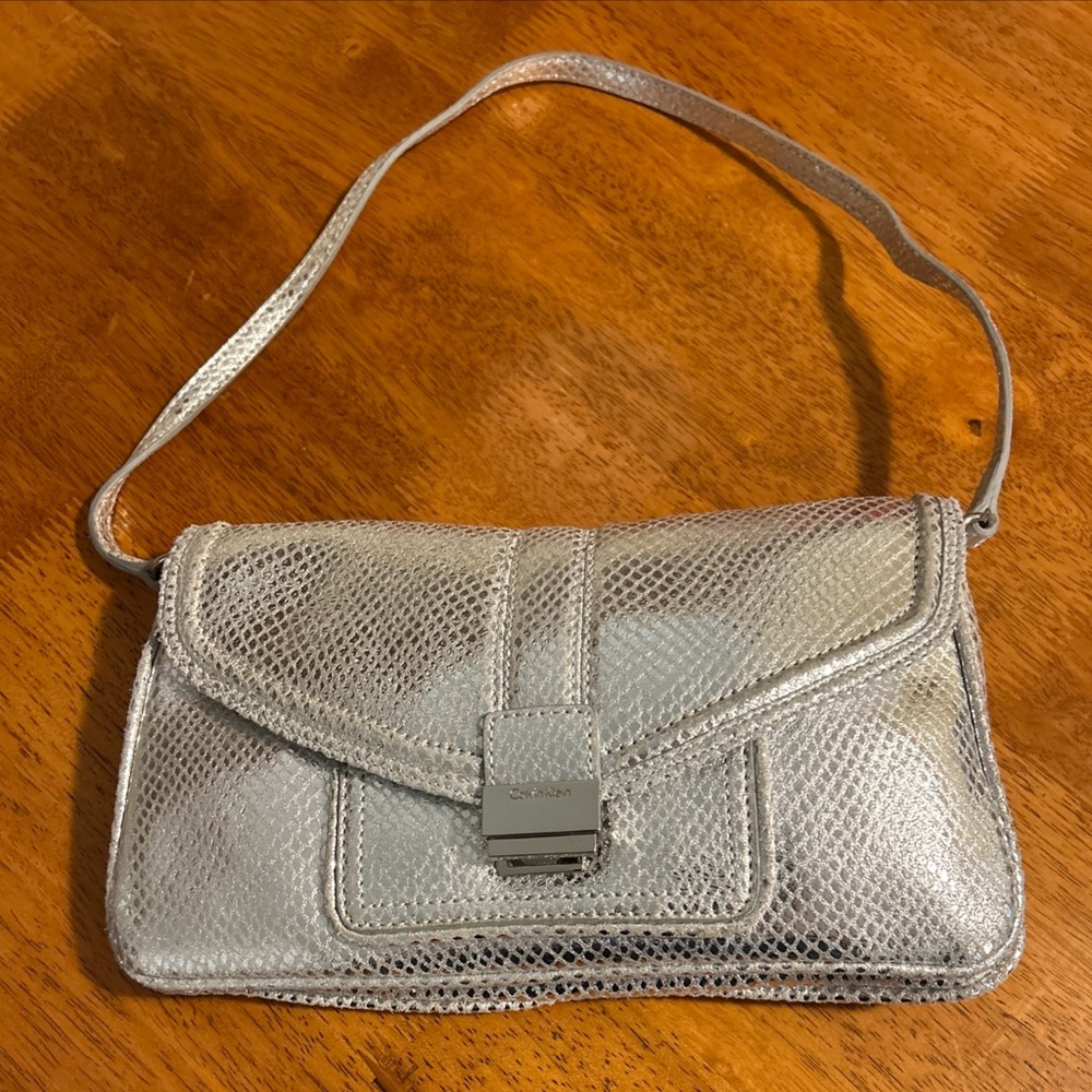 Calvin Klein Silver Designer Hand Bag with strap 
10x6